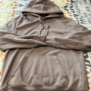 Hoodie from H&M size medium, color brown, with small design in the front